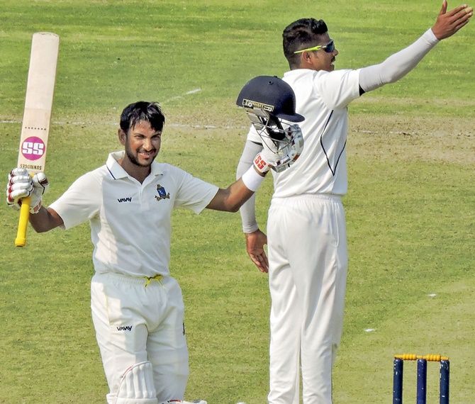 Bengal batsman Anustup Majumdar celebrates after completing his hundred on Day 1 of the Ranji Trophy quarter-final against Odisha, in Cuttack.