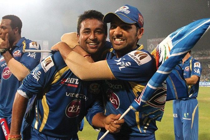 Pragyan Ohja gets a hug from captain Rohit Sharma after Mumbai Indians beat Chennai Super Kings in the final of IPL 2013.
