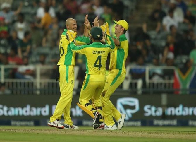 Australia's Ashton Agar celebrates with teammates after taking the wicket of South Africa's Lungi Ngidi in Saturday's first T20I at the mperial Wanderers Stadium, Johannesburg.