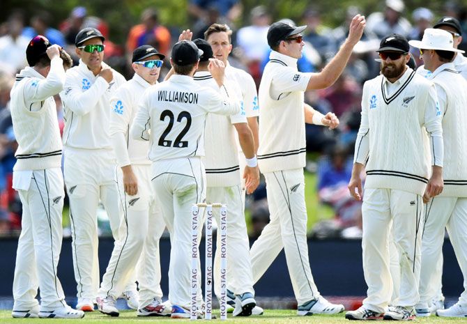 New Zealand's players celebrate after Trent Boult dismisses India opener Mayank Agarwal
