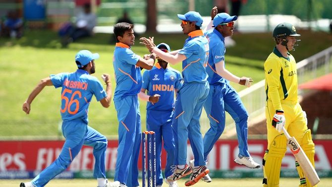 India's players celebrate after Kartik Tyagi (centre) strikes during the ICC Under-19 World Super League Cup quarter-final 1 against Australia