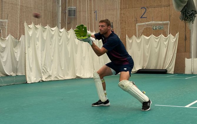 Jos Buttler practices his wicketkeeping during an England training session on Tuesday 