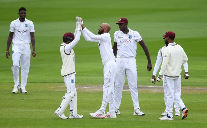 West Indies' Roston Chase celebrates after dismissing England's Rory Burns
