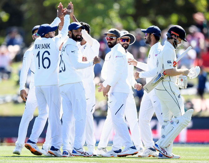 India's players celebrate after Ross Taylor is dismissed by Ravindra Jadeja