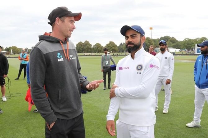 New Zealand pacer Tim Southee and India skipper Virat Kohli share a light moment after the second Test, in Chirstchurch, on Monday.