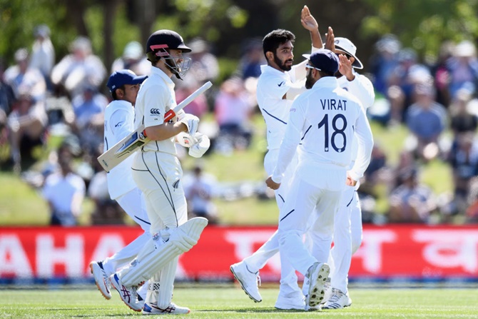India's skipper Virat Kohli and his teammates celebrate Kane Williamson's dismissal on Day 2 of the second Test against New Zealand, at Hagley Oval in Christchurch, on Sunday.