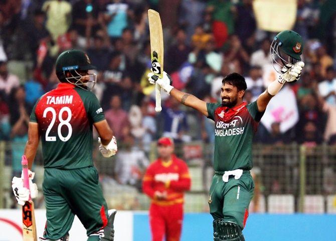 Liton Das celebrates with Tamim Iqbal after completing his century in the third One-Day International against Zimbabwe, in Sylhet, on Friday. 