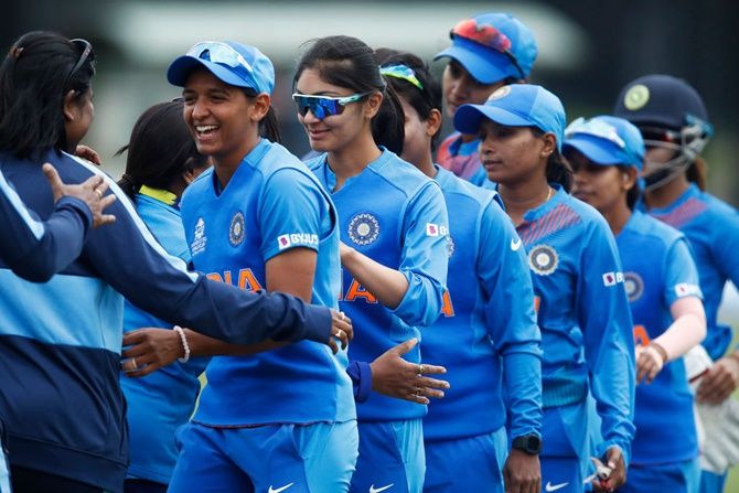 The Indian team exchanges pleasantaries with New Zealand's players after their ICC women's T20 World Cup match at Junction Oval,  in Melbourne.