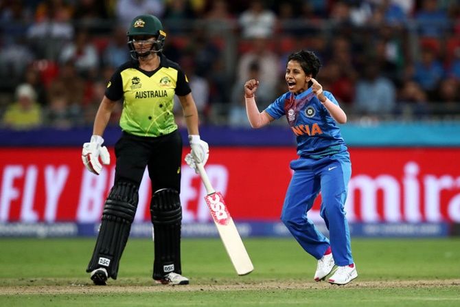 India's Poonam Yadav celebrates dismissing Australia's Ellyse Perry during their ICC women's T20 World Cup match, at GIANTS Stadium in Sydney.