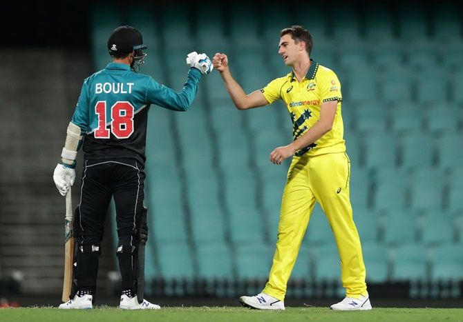Australia's Pat Cummins taps fists with New Zealand's Trent Boult at the end of the first One Day International at the Sydney Cricket Ground, in Sydney, on Friday.