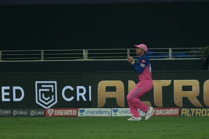 Jos Buttler takes the catch to dismiss Shubman Gill off the bowling of Rahul Tewatia