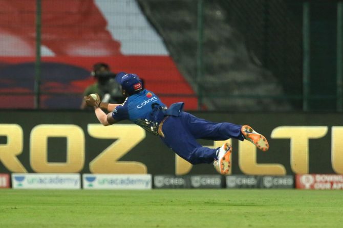 Mumbai Indians' Anukul Roy goes parallel to the ground as completes a catch to dismiss Rajasthan Royals' Mahipal Lomror off the bowling of Rahul Chahar 