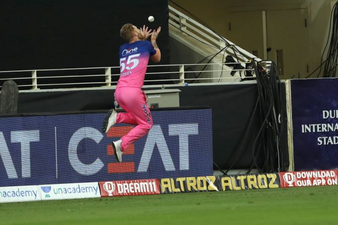 Rajasthan Royals' Ben Stokes leaps to stop the ball from going to the boundary during the match against Delhi Capitals on October 14, 2020. 