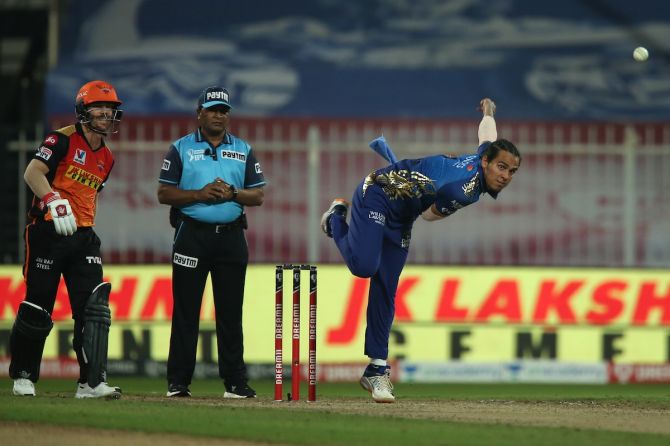 Mumbai Indians spinner Rahul Chahar bowls during the IPL match against Sunrisers Hyderabad at the Sharjah Cricket Stadium.