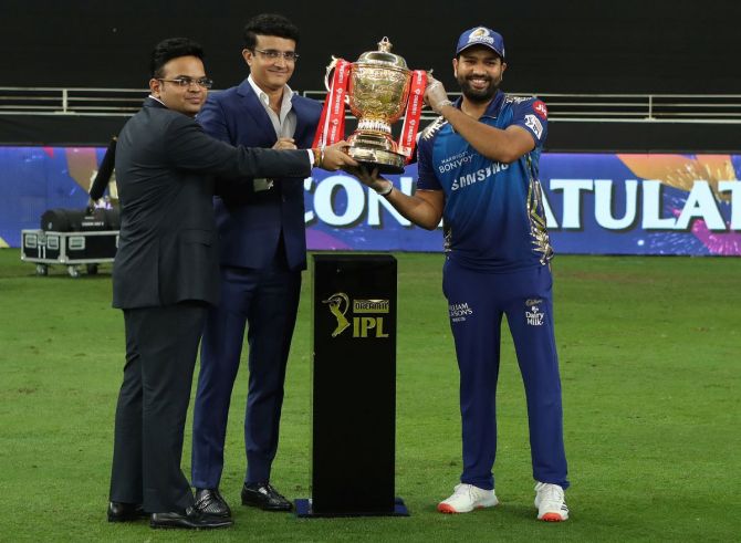 BCCI Secretary Jay Shah and BCCI President Sourav Ganguly present the winners' trophy to MI captain Rohit Sharma after winning the IPL final on Tuesday