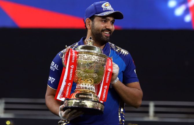 Mumbai Indians captain Rohit Sharma is all smiles after receiving the IPL trophy