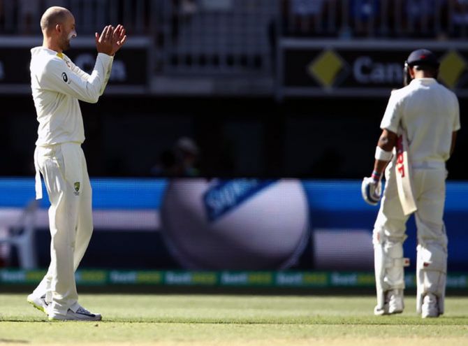 Nathan Lyon celebrates after dismissing Virat Kohli during the second Test in Perth in December 2018. He became the most successful bowler against the Indian captain, scalping his wicket seven times.