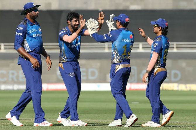 Jasprit Bumrah celebrates with teammates on dismissing Marcus Stoinis. Bumrah finished with figures of 3 for 17 in his four overs
