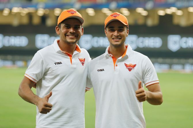 Sunrisers Hyderabad batsmen Priyam Garg, left, and Abhishek Sharma after their match-winning partnership against Chennai Super Kings in Friday's IPL match in Dubai.