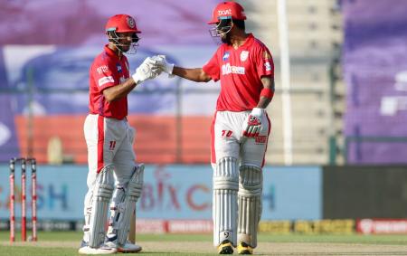 Kings XI Punjab openers KL Rahul and Mayank Agarwal celebrate their hundred runs partnership.