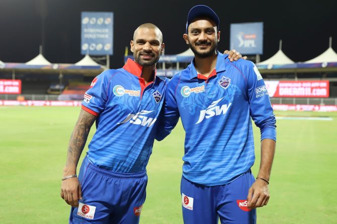 Delhi Capitals heroes Shikhar Dhawan and Axar Patel celebrate victory over Chennai Super Kings in the IPL match in Sharjah on Saturday.