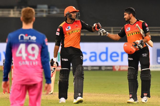 SunRisers Hyderabad batsmen Vijay Shankar, left, and Manish Pandey celebrate victory over Rajasthan Royals