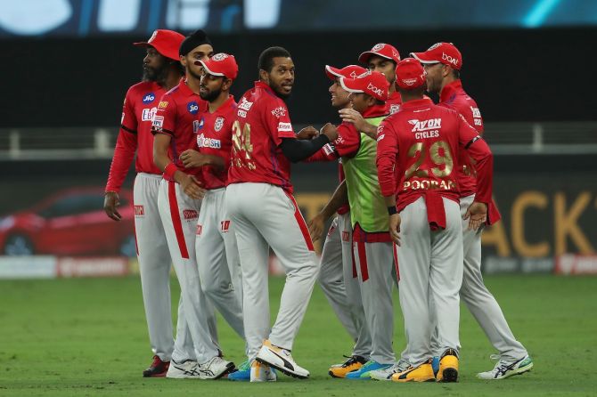 Kings XI Punjab pacer Chris Jordan celebrates with teammates after dismissing Sunrisers Hyderabad's Manish Pandey