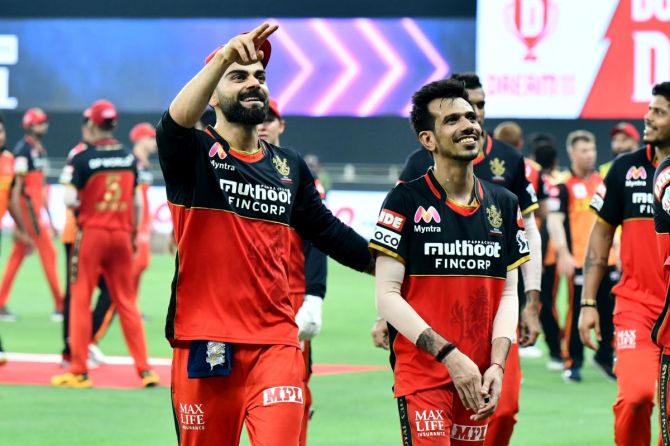 RCB captain Virat Kohli celebrates with Yuzvendra Chahal after defeating SunRisers Hyderabad in their opening Indian Premier League match on Monday. Chahal had figures of 3 for 18 in the match.
