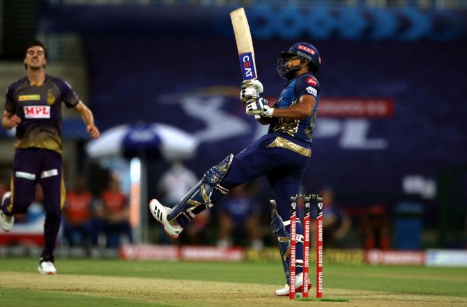 Mumbai Indian skipper Rohit Sharma goes on the backfoot to send a delivery from Pat Cummins over the boundary during Wednesday's IPL match against Kolkata Knight Riders in Abu Dhabi.