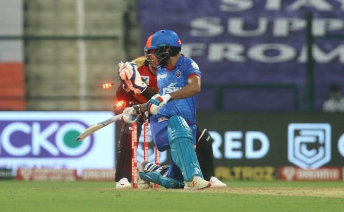 Delhi Capitals' Shikhar Dhawan is out stumped by Jos Buttler off the bowling of Rashid Khan