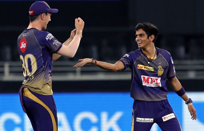 Kamlesh Nagarkoti, right, celebrates with teammate Pat Cummins after taking the wicket of Robin Uthappa
