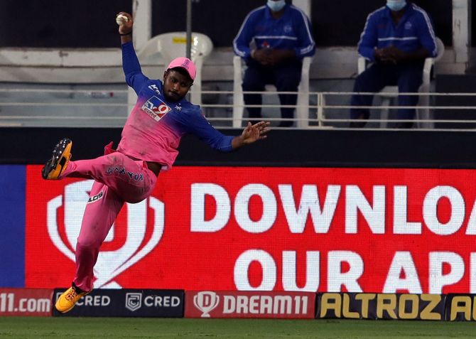 Sanju Samson takes the catch to dismiss Pat Cummins off the bowling of Tom Curran