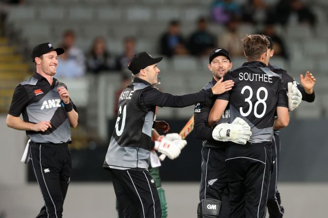 New Zealand players celebrate a wicket during the 3rd T20I in Auckland on Thursday