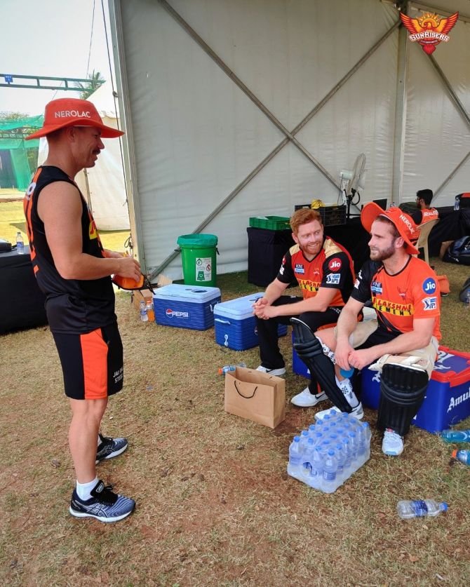 Sunrisers Hyderabad's David Warner, Jonny Bairstow and Kane Williamson have a chat at a training session on Thursday