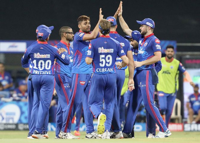 Delhi Capitals players celebrate after Avesh Khan takes the wicket of Faf du Plessis