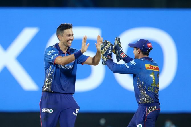 Mumbai Indians pacer Trent Boult celebrates with wicketkeeper Quinton de Kock after dismissing Kolkata Knight Riders batsman Andre Russell during Tuesday's IPL match in Chennai.