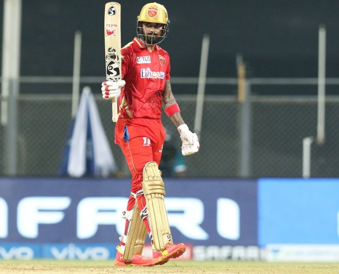 K L Rahul celebrates after completing his 50