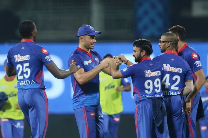 Delhi Capitals spinner Amit Mishra celebrates with Marcus Stoinis and Kagiso Rabada after dismissing Mumbai Indians batsman Hardik Pandya during the IPL match in Chennai on Tuesday.