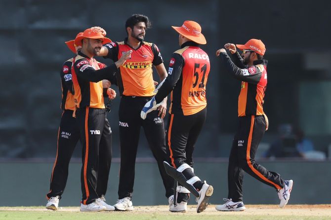 Khaleel Ahmed applauds Rashid Khan after the Afghan takes the catch to dismiss Mayank Agarwal
