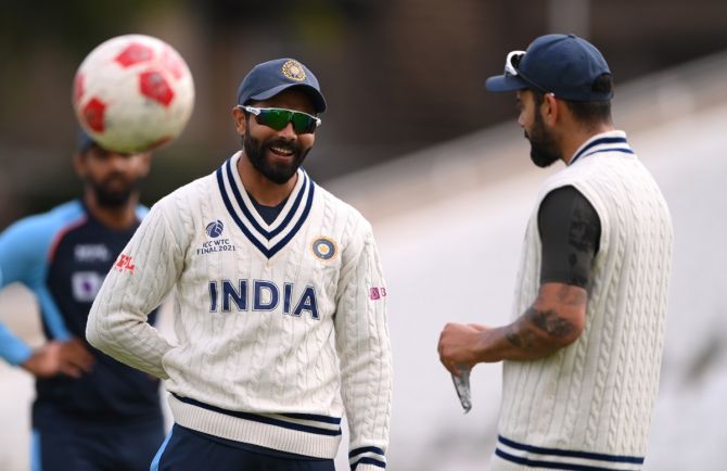 Ravindra Jadeja, left, shares a light moment with captain Virat Kohli during India's nets session ahead of the first Test against England, at Trent Bridge in Nottingham