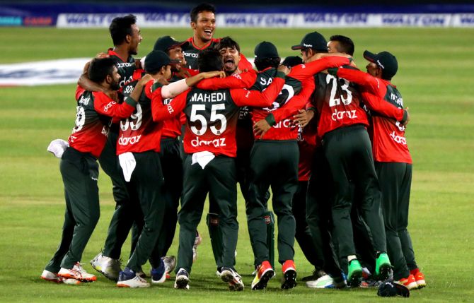 Bangladesh's players celebrate after winning the third T20 International