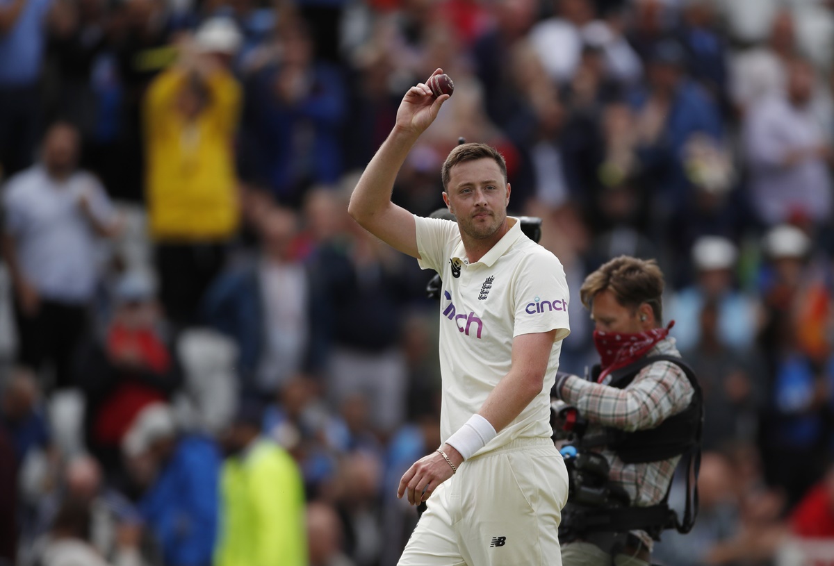 England's Ollie Robinson celebrates taking the wicket of India's Jasprit Bumrah and completing a five-wicket haul on Day 3 of the first Test, at Nottingham, on Friday