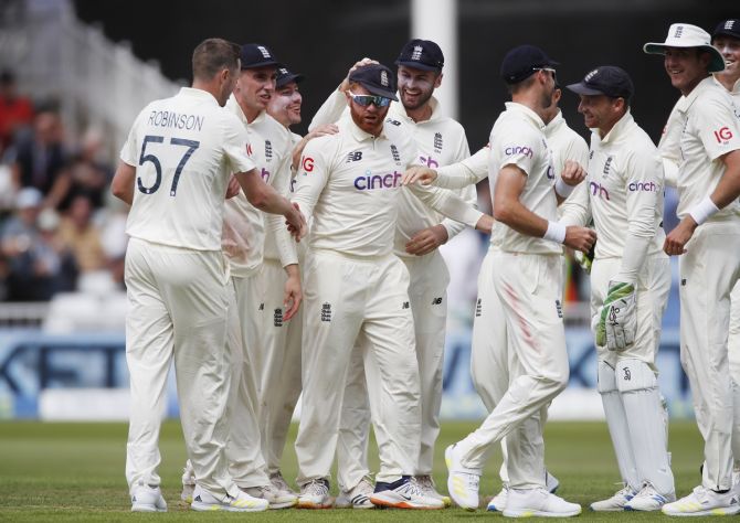 England's Jonny Bairstow celebrates with teammates after running out India's Ajinkya Rahane during the first Test, at Trent Bridge, in Nottingham. 