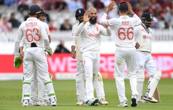 Moeen Ali celebrates after taking the wicket of Mohammed Shami.