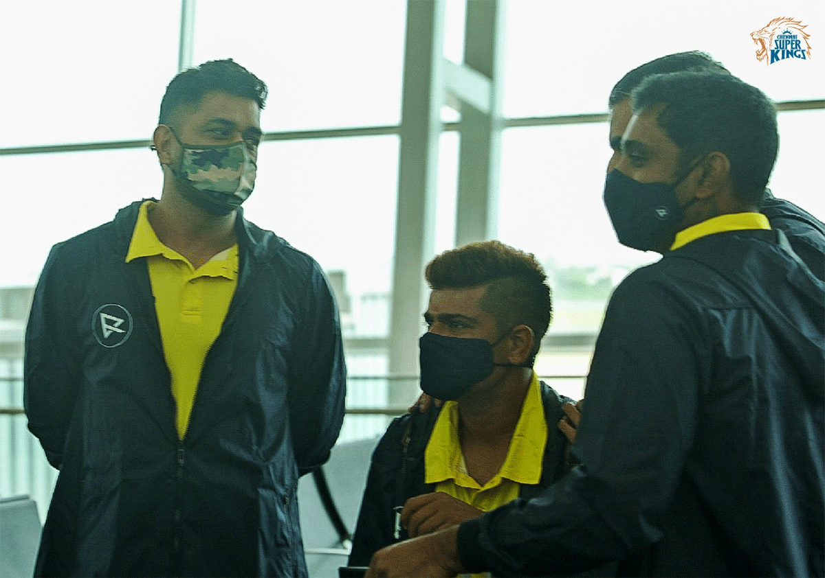 Mahendra Singh Dhoni with teammates at the airport before departure on Friday