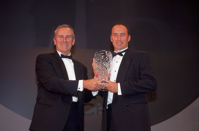 England's Nasser Hussain, right, collects the 'Spirit of Cricket' award, on behalf of former West Indies captain Jimmy Adams, from Ted Dexter during the Fleming Premier Banking Professional Cricketers Association Awards at the Royal Albert Hall in London, September 19, 2000. 