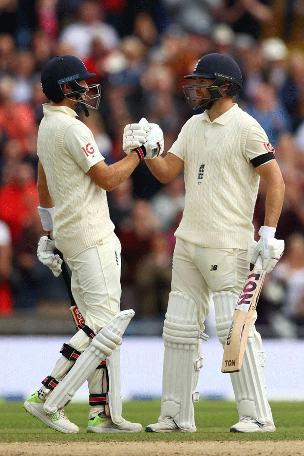 England captain Joe Root celebrates with Dawid Malan after completing a half-century.