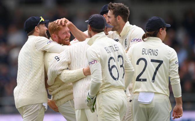 Jonny Bairstow is congratulated by bowler Craig Overton and his England teammates after taking the catch to dismiss opener K L Rahul in India's second innings, on Day 3 of the third Test, at Emerald Headingley stadium, on Friday. 