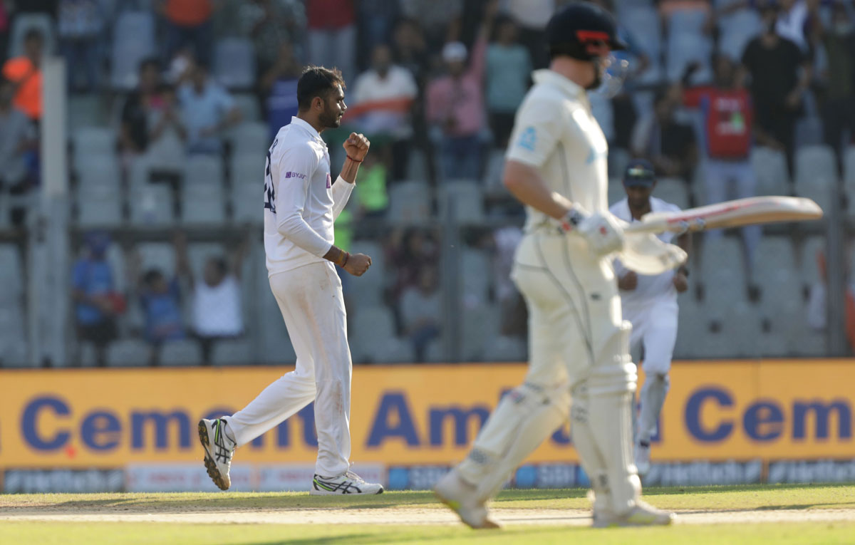Axar Patel celebrates the wicket of Daryl Mitchell