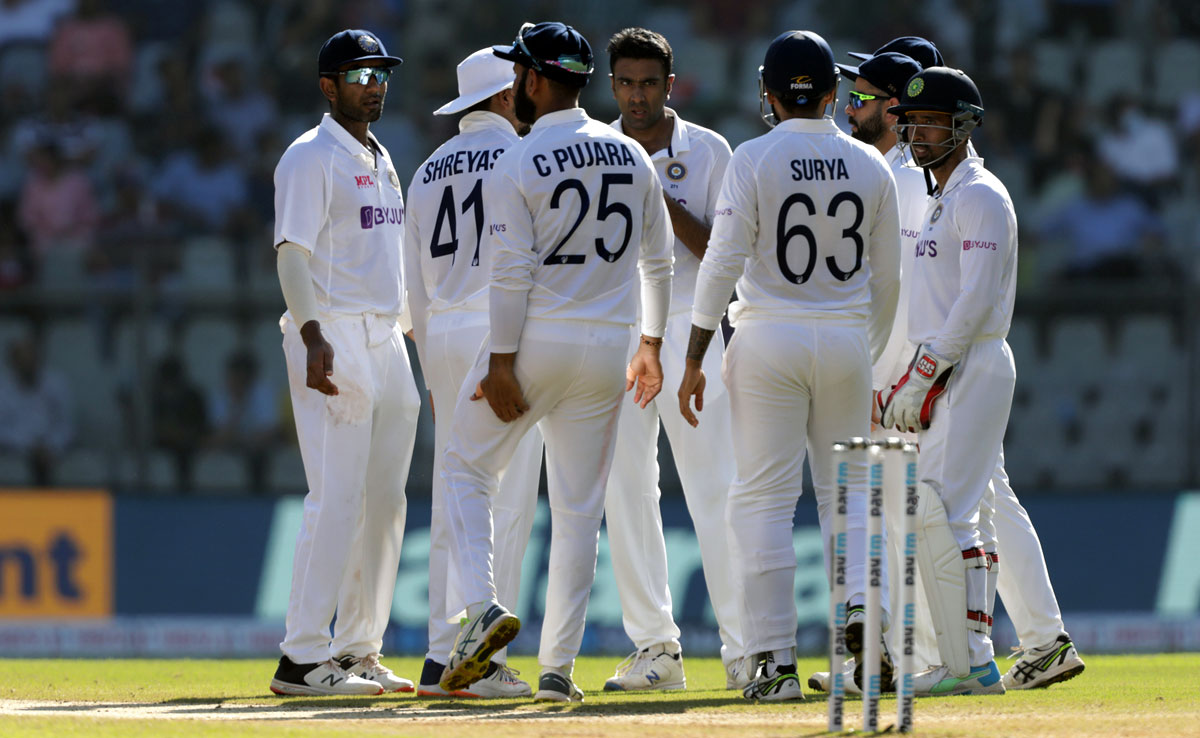 Ravichandran Ashwin celebrates with his India teammates after dismissing William Young.